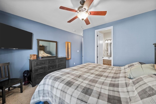 carpeted bedroom with connected bathroom and ceiling fan