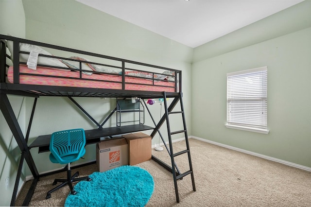 bedroom featuring carpet and baseboards