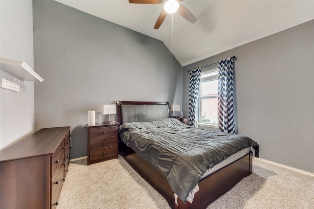 carpeted bedroom featuring baseboards, ceiling fan, and vaulted ceiling