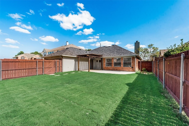 rear view of property with a lawn, a pergola, brick siding, a chimney, and a patio area