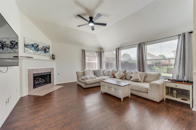 living room featuring lofted ceiling, wood finished floors, a wealth of natural light, and ceiling fan