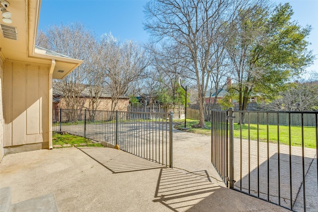 exterior space with a patio area, a lawn, and fence