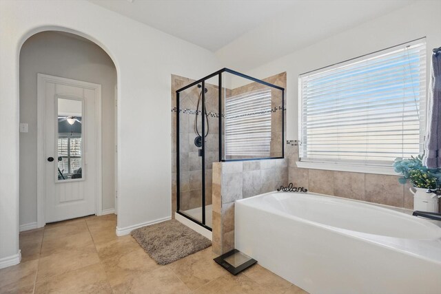 108 Zion Ln, Forney, TX 75126 - bathroom featuring healthy amount of natural light, a shower stall, a bath, and tile patterned floors
