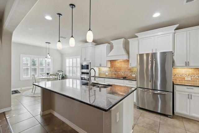 108 Zion Ln, Forney, TX 75126 - kitchen featuring appliances with stainless steel finishes, a sink, custom exhaust hood, white cabinets, and recessed lighting