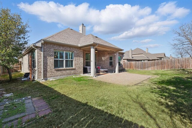 108 Zion Ln, Forney, TX 75126 - back of property with brick siding, ceiling fan, a chimney, and a patio