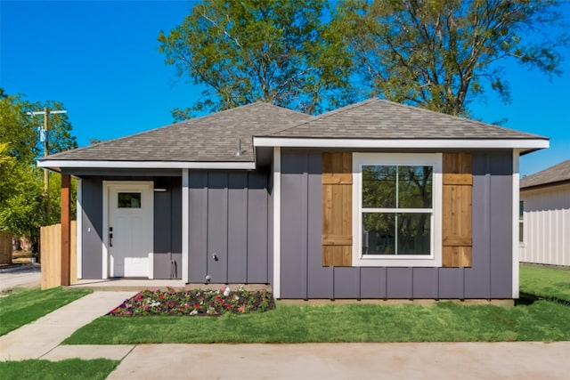 1403 Franklin Ave, Bonham, TX 75418 - view of front of property featuring board and batten siding and roof with shingles