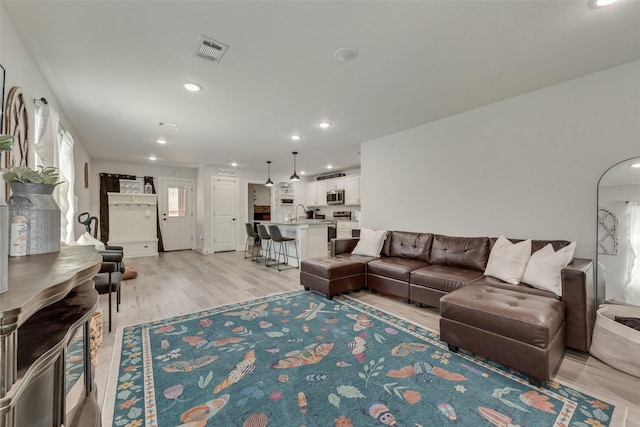 1403 Franklin Ave, Bonham, TX 75418 - living area with light wood-type flooring and recessed lighting
