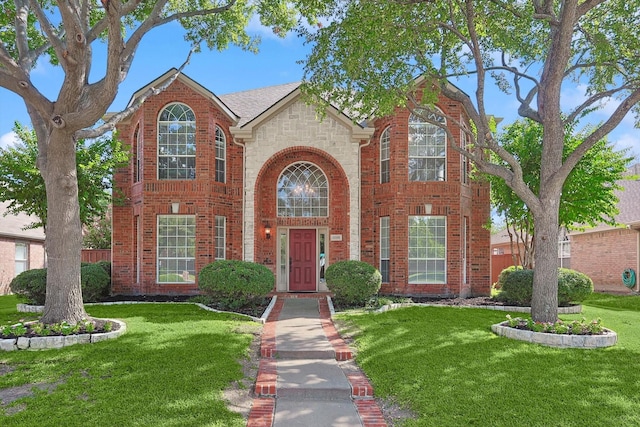 11101 Lockshire Dr, Frisco, TX 75035 - traditional-style home featuring a front lawn, brick siding, and stone siding