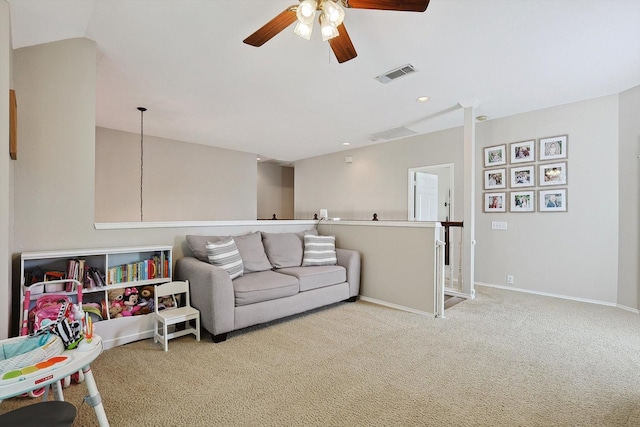 carpeted living area featuring recessed lighting, visible vents, baseboards, and ceiling fan