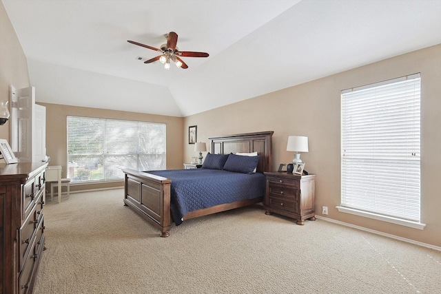 bedroom featuring baseboards, light colored carpet, ceiling fan, and vaulted ceiling