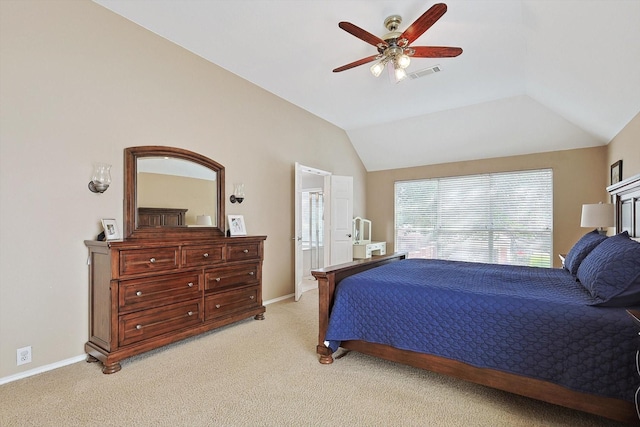 bedroom featuring visible vents, baseboards, light colored carpet, ceiling fan, and vaulted ceiling