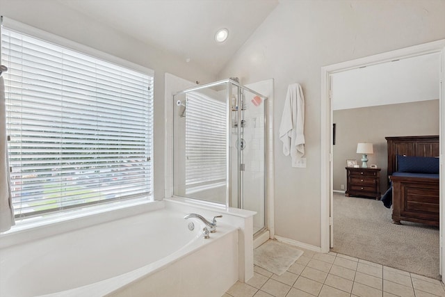 full bathroom with tile patterned floors, a garden tub, a shower stall, and vaulted ceiling