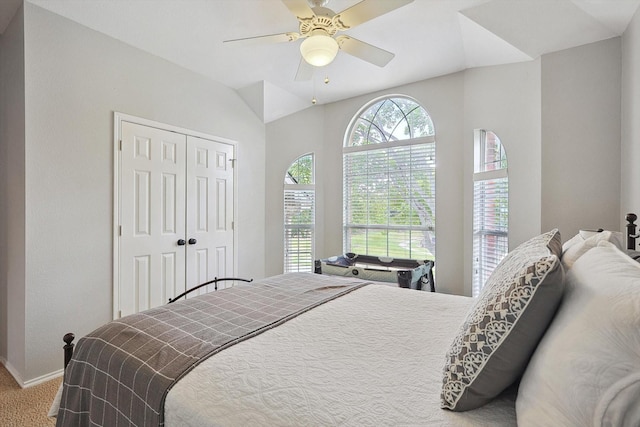 carpeted bedroom featuring baseboards, a closet, and ceiling fan