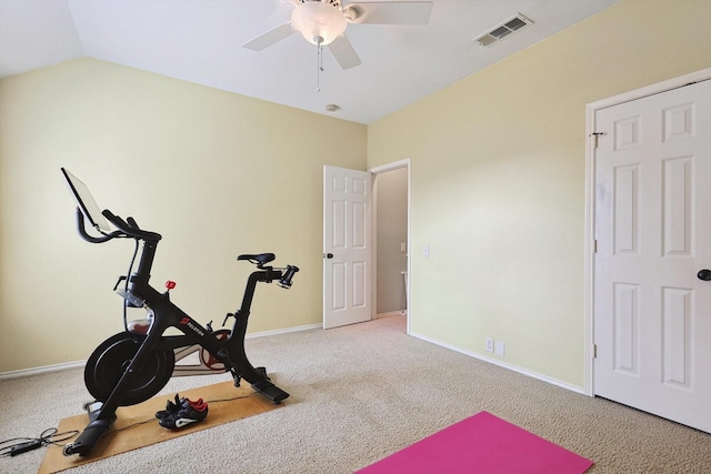 exercise area with visible vents, lofted ceiling, carpet floors, baseboards, and ceiling fan