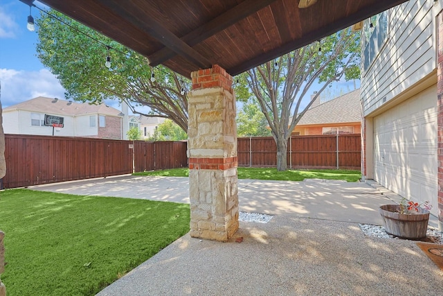 view of patio / terrace featuring fence