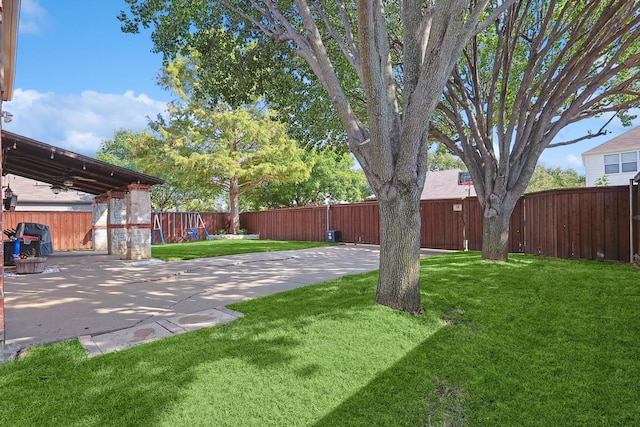 view of yard featuring a fenced backyard and a patio area