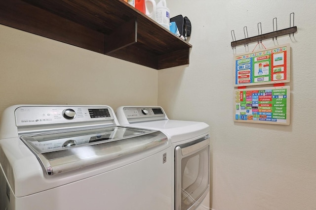 laundry area featuring laundry area and washer and clothes dryer