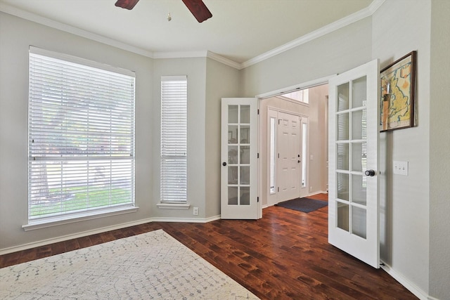 entrance foyer featuring baseboards, dark wood-style flooring, ceiling fan, ornamental molding, and french doors