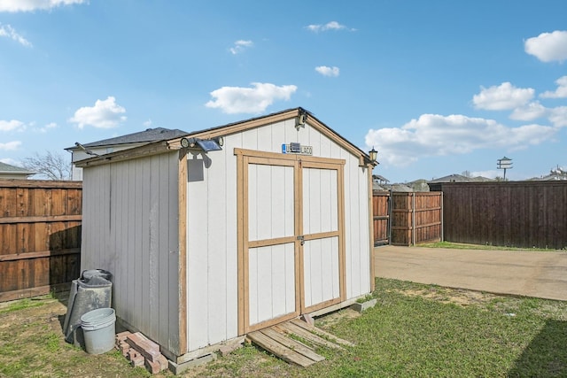 view of shed featuring a fenced backyard