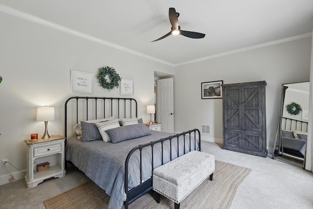 bedroom featuring visible vents, a ceiling fan, carpet floors, crown molding, and baseboards