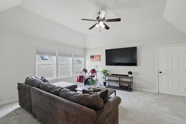 living room with baseboards, light colored carpet, ceiling fan, and vaulted ceiling