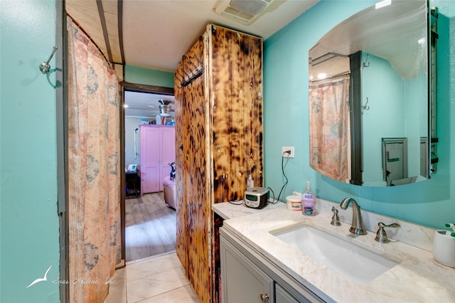 bathroom featuring visible vents, vanity, and tile patterned flooring