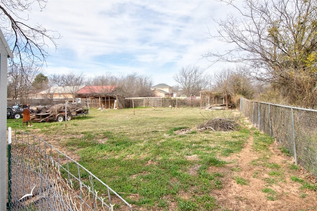 view of yard with an outbuilding and a fenced backyard