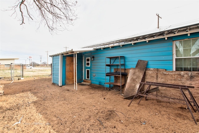 exterior space with metal roof