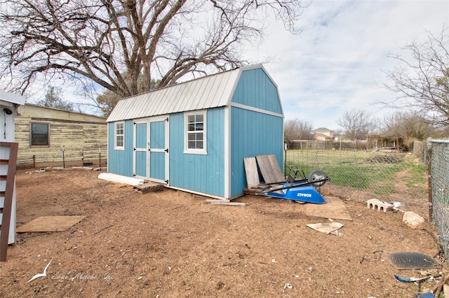 view of shed with fence