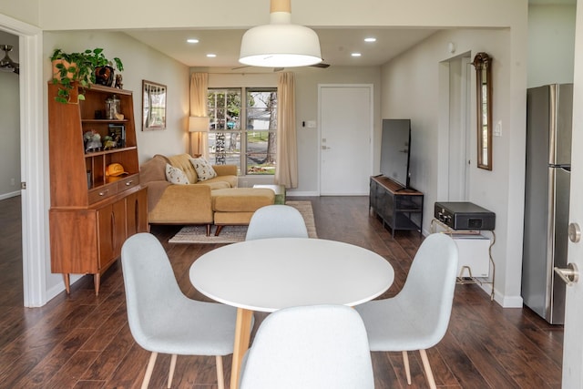 dining area featuring recessed lighting, baseboards, and dark wood-style flooring