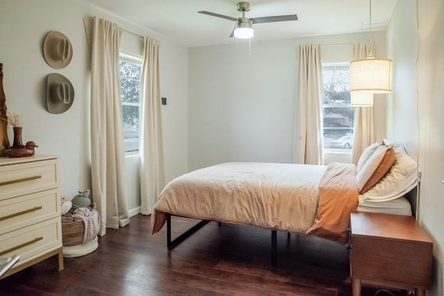 bedroom featuring dark wood-type flooring and ceiling fan