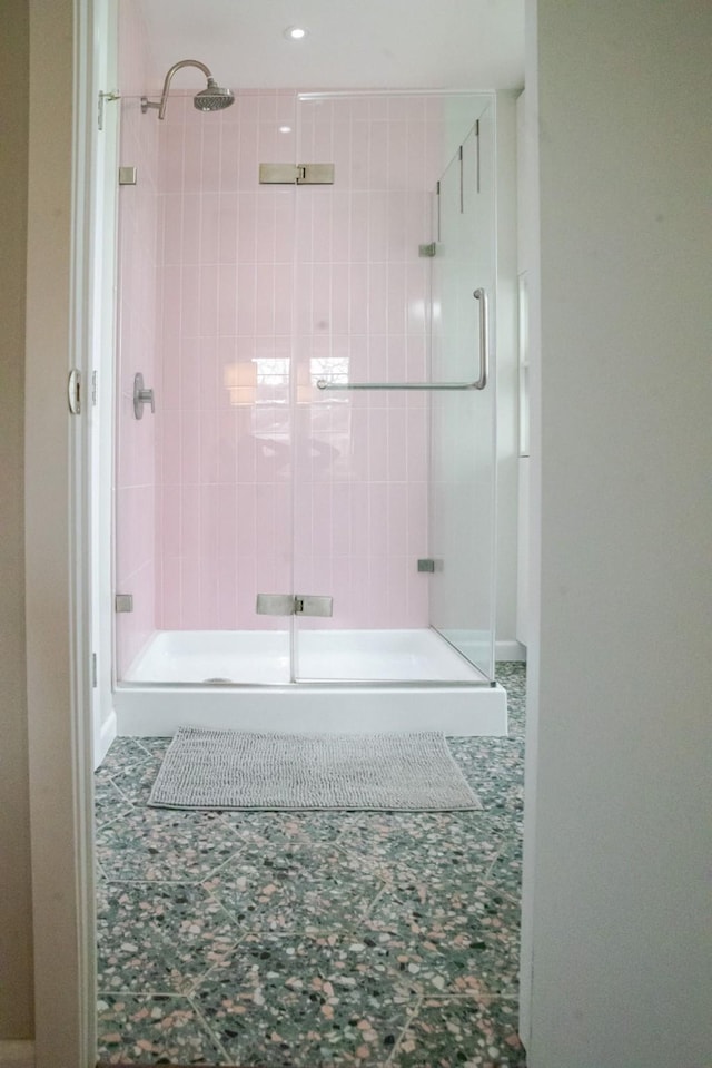 full bathroom featuring a shower stall and tile patterned floors