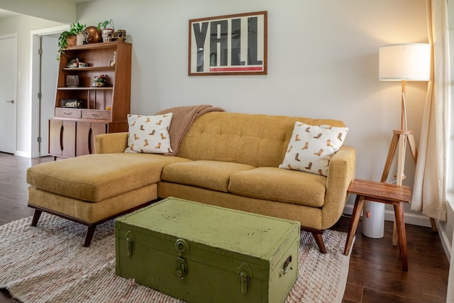 living room with dark wood-style floors and baseboards