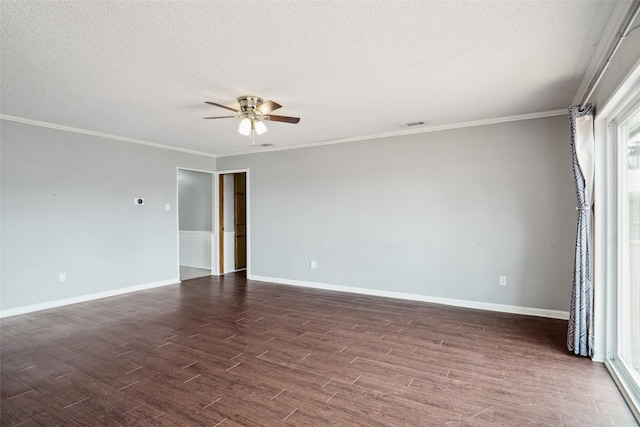 spare room featuring dark wood-type flooring, a textured ceiling, crown molding, baseboards, and ceiling fan