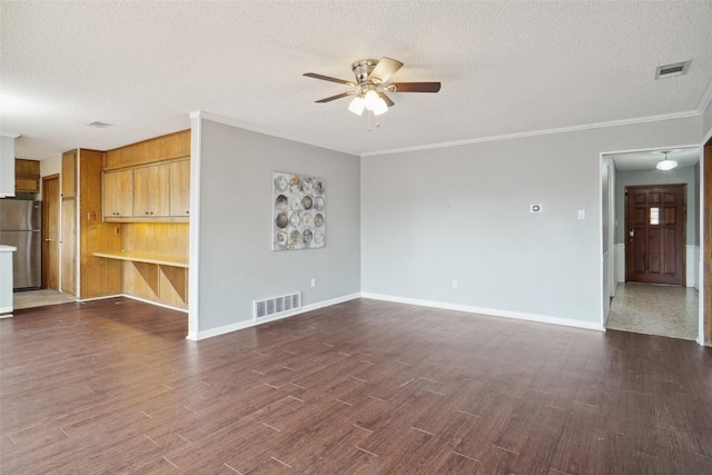 unfurnished living room with dark wood-style floors, visible vents, and a ceiling fan