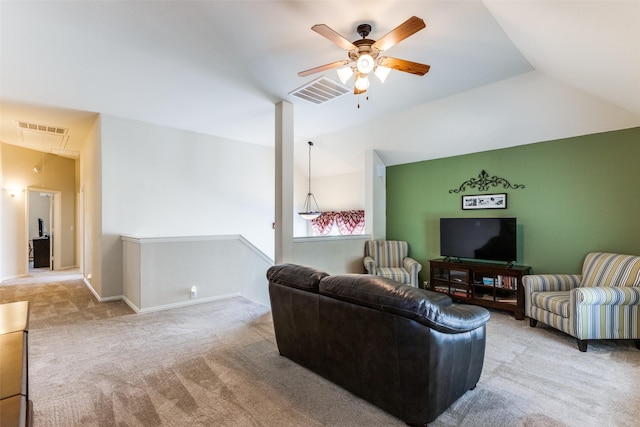 carpeted living area featuring lofted ceiling, a ceiling fan, visible vents, and baseboards