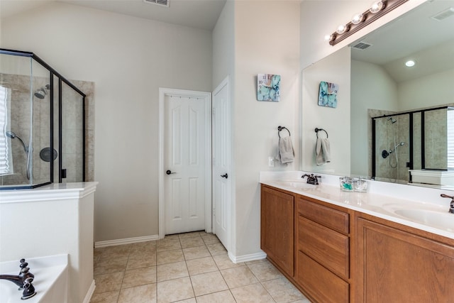 2728 Pine Trail Dr, Little Elm, TX 75068 - bathroom featuring a shower stall, double vanity, tile patterned flooring, vaulted ceiling, and a tub to relax in