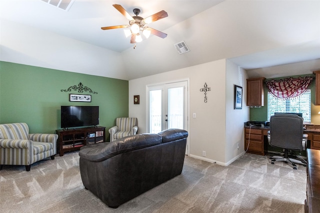 living area featuring vaulted ceiling, baseboards, visible vents, and carpet floors