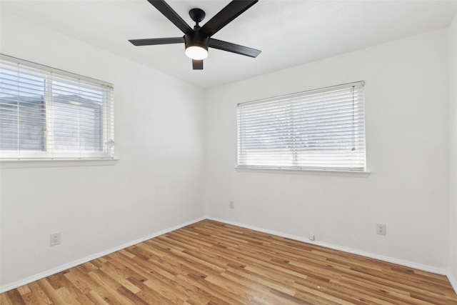 unfurnished room with light wood-style flooring, baseboards, and ceiling fan