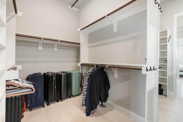 spacious closet with tile patterned flooring