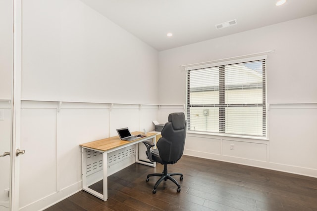 office featuring recessed lighting, visible vents, dark wood-type flooring, and a wainscoted wall