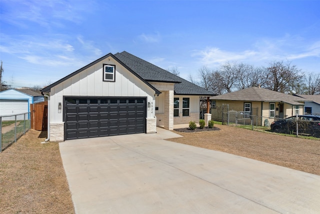 modern inspired farmhouse with a garage, fence, board and batten siding, and driveway