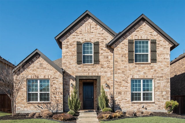 view of front facade featuring brick siding