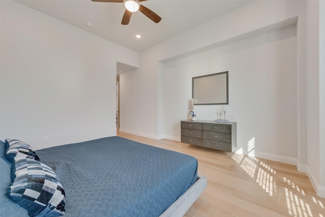 bedroom featuring a ceiling fan, light wood-style flooring, recessed lighting, and baseboards