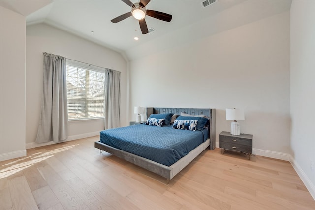 bedroom featuring visible vents, lofted ceiling, recessed lighting, light wood-style floors, and baseboards