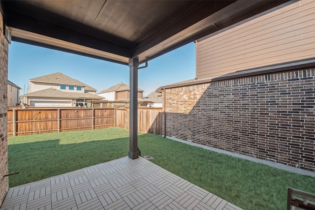 view of yard featuring a patio and a fenced backyard