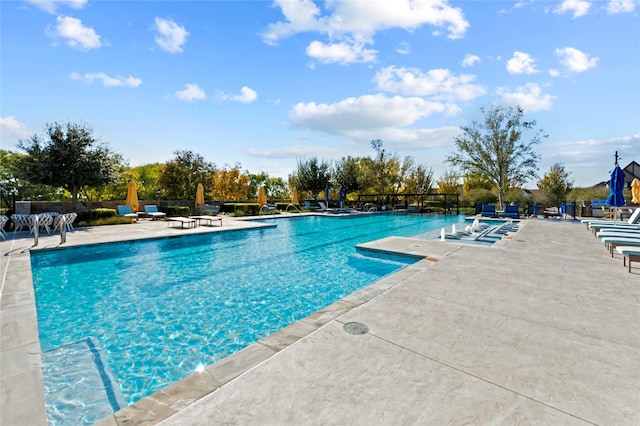 community pool featuring a patio area