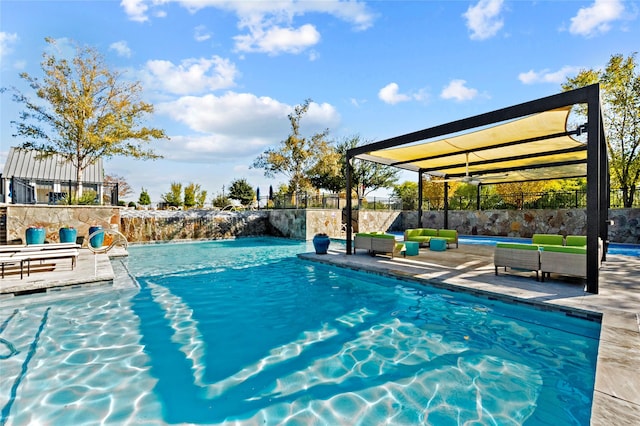 view of swimming pool with a patio area, a fenced in pool, and fence