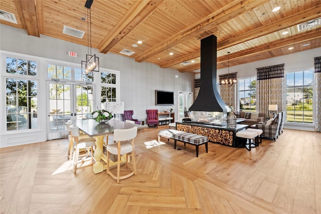 dining room with beamed ceiling, a notable chandelier, and visible vents