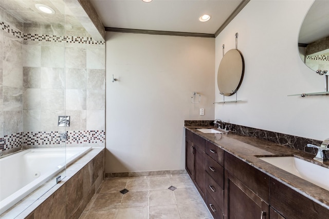 full bath with double vanity, ornamental molding, a whirlpool tub, and a sink